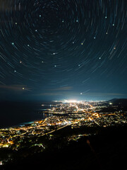 Star trails view above the city light.