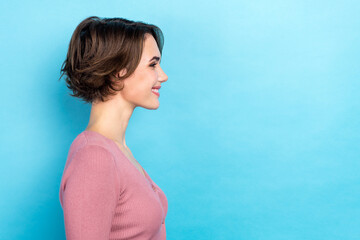 Profile portrait of satisfied glad lovely lady beaming smile look empty space isolated on blue...