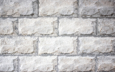Stone blocks background.Old facing wall.Facade cover. light blocks.