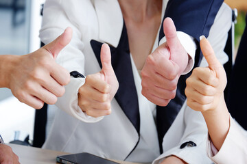 businessman hand showing thumbs up congratulations excellent.