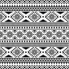 Seamless native pattern with unique tribal background design. Aztec Navajo ethnic style. Black and white colors. Design for textile, fabric, curtain, rug, batik, ornament, background, wrapping.