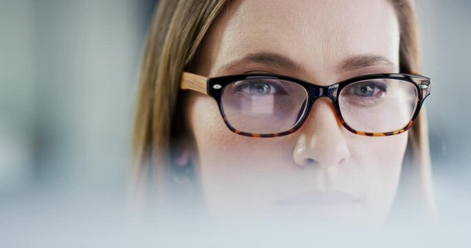 Computer, office and face of woman focus on company analytics, online analysis or research project. Eyes, reading and professional person concentrate on problem solving, business work or statistics