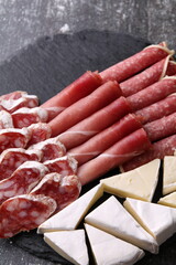 photo sliced sausage and slices of cheese