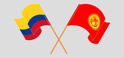 Crossed and waving flags of Colombia and Kyrgyzstan