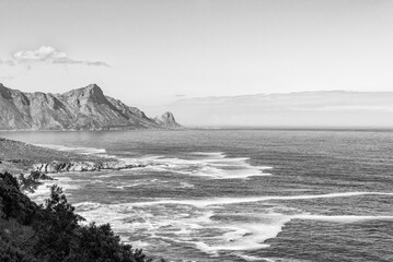 Rooiels visible across the bay from Clarence Drive. Monochrome