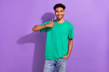Portrait of funny excited young guy youngster raise thumb finger up approve agree appoint isolated purple color background