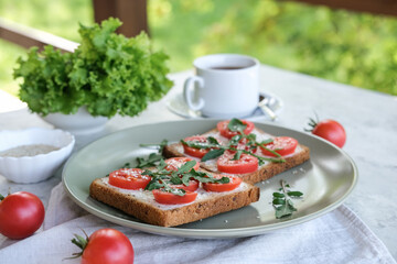 Breakfast with sandwiches and coffee is served on the summer terrace or balcony.