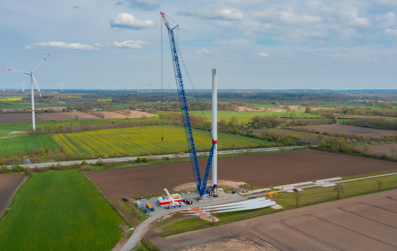 Construction of a wind turbine with a blue crawler crane