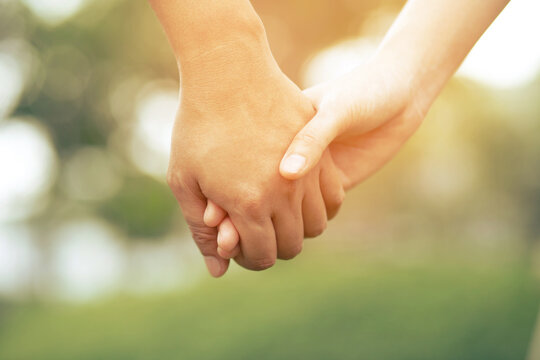 Woman and man holding hands, Happy couple love in the garden. concept couple lover valentine day