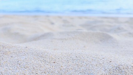 Fototapeta na wymiar Texture of sand beach on sunset in summertime. 
