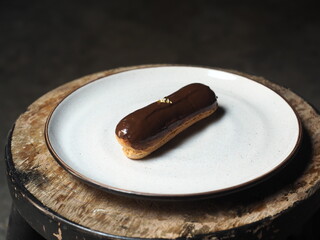eclair with chocolate glaze on plate