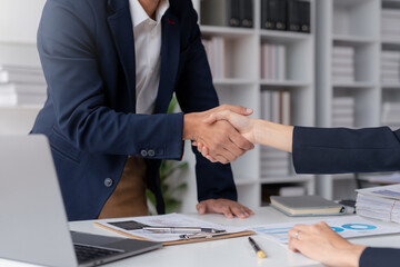 Business success. Business people handshake agreement confirmed in the investment business. Successful business people meeting together.