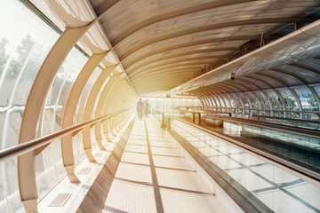 Obraz premium Walking Inside Airport to terminal. Escalator in the airport. 
