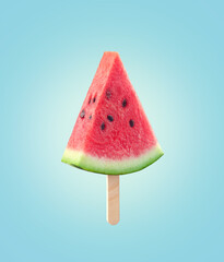 Fresh juicy watermelon slice on ice-cream stick, blue background, sunny mood