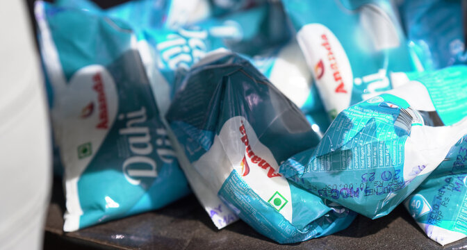 Close up image of lot of amul dahi bags