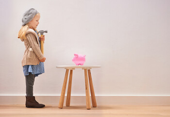 Waiting, piggy bank and a girl with a hammer for money, savings and finance in a house. Investment,...