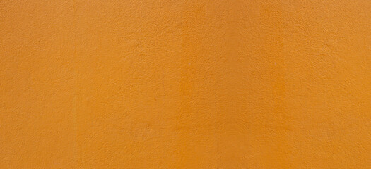 Wide Surface of Smooth orange cement wall texture background for design in your work concept backdrop.