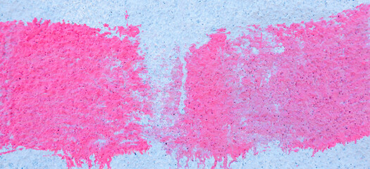 Pink paint strokes and smudges on an old light blue wall background. Abstract urban banner background