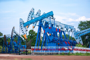 In the field country crude oil industry the oil rig pump in the evening of the pumping
