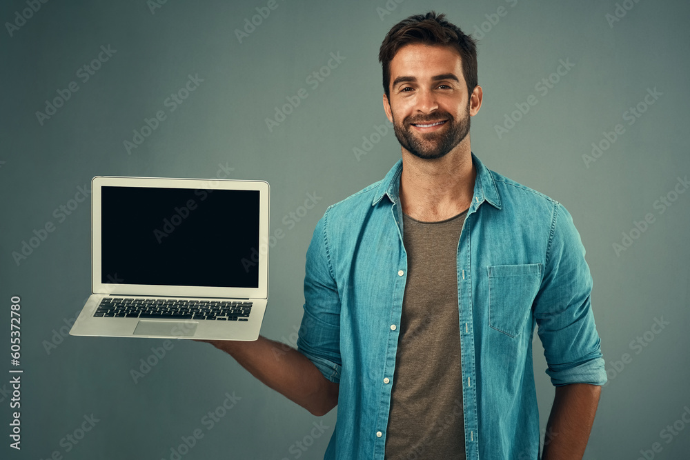 Poster happy man, laptop and mockup screen for advertising or marketing against a grey studio background. p