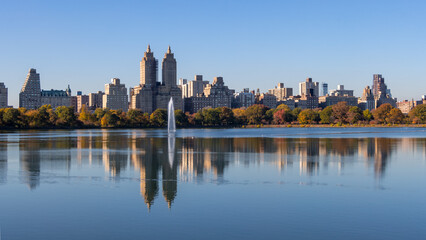 Fototapeta na wymiar Central Park lake in New York with reflection during sunny autumn day