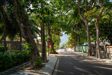 Obraz premium view of main road which leads along the coastline mountains in Con Son town. Con Dao island is one of the famous destinations in southern Vietnam
