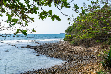 a peaceful Con Dao island, Vietnam is a Vietnamese island heaven. Coastal view with waves, coastline, clear sky and road, blue sea, tourists and mountain