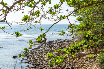 a peaceful Con Dao island, Vietnam is a Vietnamese island heaven. Coastal view with waves, coastline, clear sky and road, blue sea, tourists and mountain