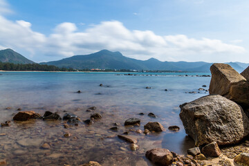 a peaceful Con Dao island, Vietnam is a Vietnamese island heaven. Coastal view with waves, coastline, clear sky and road, blue sea, tourists and mountain