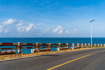 Obraz premium View of ocean road in Nhat beach, Con Dao island, Vietnam. Beautiful and tranquil, it is a proud destination worth exploring in Vietnam.