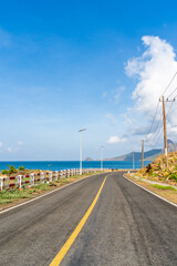 Fototapeta premium View of ocean road in Nhat beach, Con Dao island, Vietnam. Beautiful and tranquil, it is a proud destination worth exploring in Vietnam.