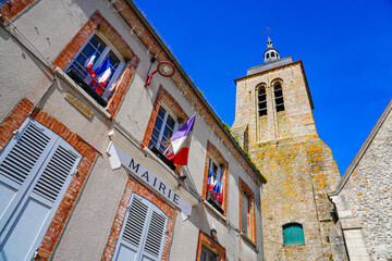 Church of Saint Genevieve overlooking the City Hall of the small village of Montigny Lencoup in the French department of Seine et Marne in the capital region of Ile de France near Paris