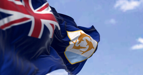 Anguilla Flag waving in the wind on a clear day - obrazy, fototapety, plakaty