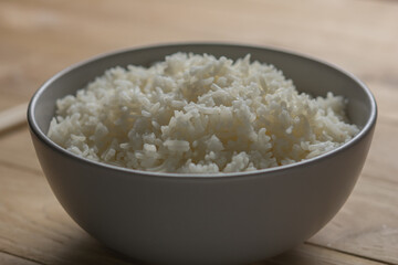 cooked rice on bowl on wooden background, Jasmine rice cooked