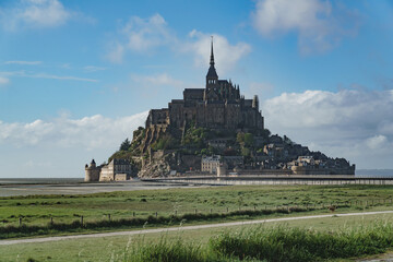 Fototapeta na wymiar St Mont Michel. Mont-Saint-Michel in France. A grand, awe inspiring building of historic significance, the Abbey on the tidal island in Northern France