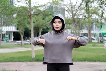 asian young muslim female excercise at park