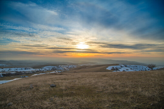 Landscape golden dry grass meadow on high mountain at sunrise. Natural autumn and winter background. - Powered by Adobe