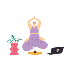 Yong woman watching online yoga classes on laptop, practicing yoga at home.