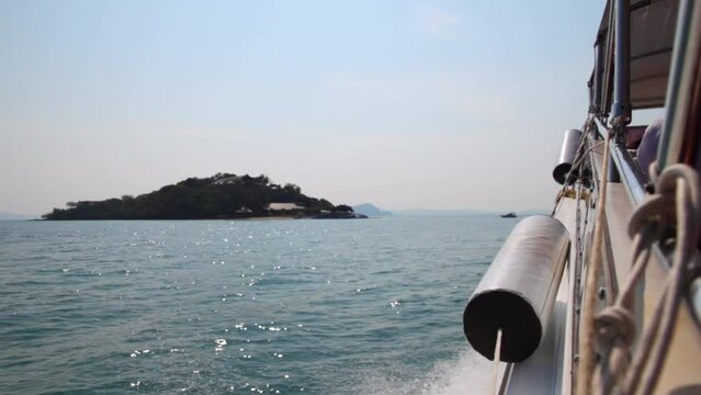 Speed boat sailing on the sea in thailand with waves splashing from the side. Rest and vacation in Thailand.