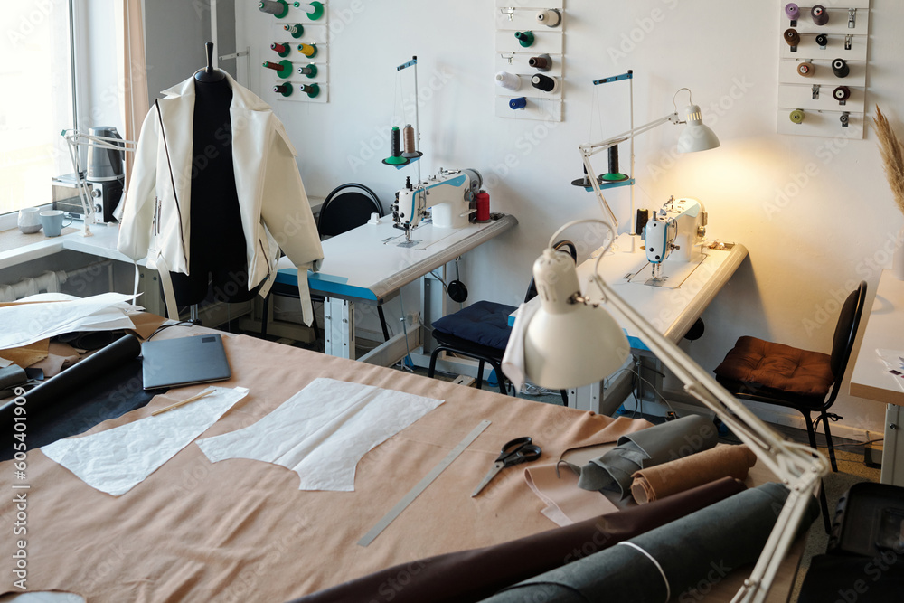 Poster large table of tailor or leatherworker with paper patterns on textile, rolled suede or lether, manne