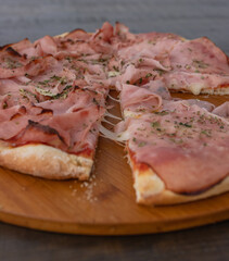 A slice of hot Italian pizza with cheese stretches