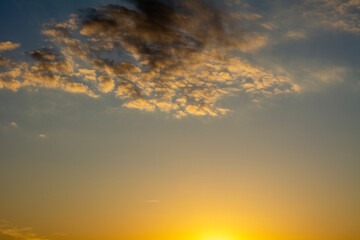 The setting sun illuminating the sky.