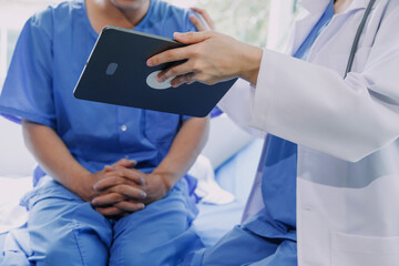 Male patient having consultation with doctor or psychiatrist who working on diagnostic examination...