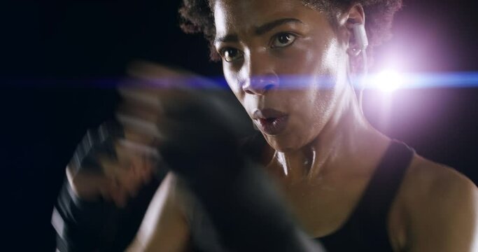 Boxing, punch and fight with face of black woman in studio for martial arts, workout and strong. Focus, health and cardio with female boxer on dark background for training, exercise and performance