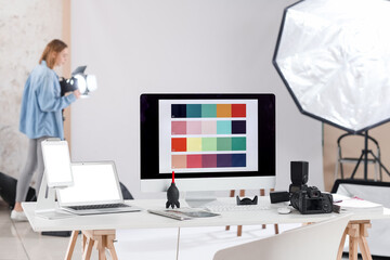 Photographer's workplace with devices in studio