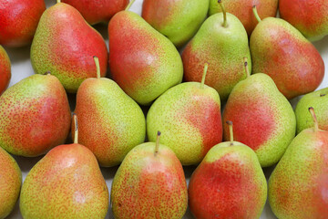 Fresh pears as background