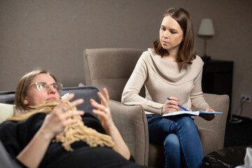 Woman lies on sofa and complains on terrible attitude of daughter at therapy. Psychologist listens...