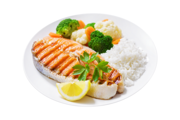 plate of grilled salmon steak, rice and vegetables isolated on transparent background