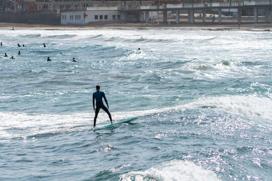 surfing on the beach of la cicer in Las Plamas de Gran Canaria