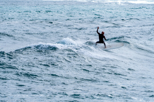 surfing on the beach of la cicer in Las Plamas de Gran Canaria